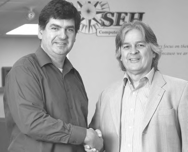 Allan Griwatz (left) with SEH Computer Systems Inc. President Kevin Remington. (Bill Gladding / Tavistock Gazette)